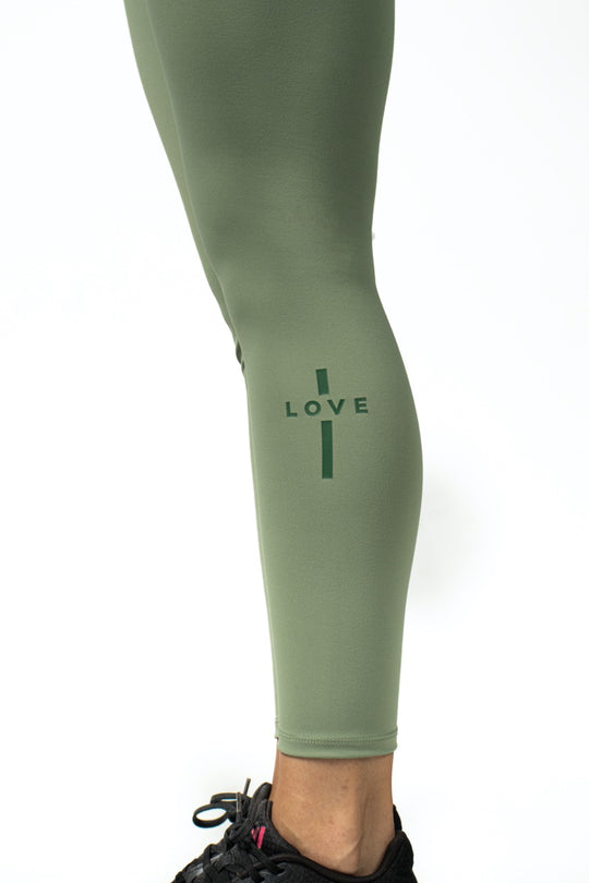 Elev8 green leggings cross print leg detail — faith gym wear SA